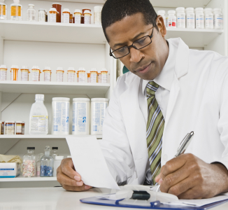 Pharmacist reviewing paperwork
