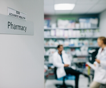 Two people in a pharmacy